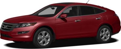 Side profile of red wagon with alloy wheels and aerodynamic design