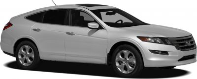 Side profile of a silver wagon with sunroof and alloy wheels.
