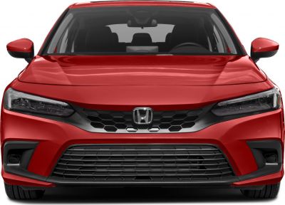 Front view with sleek headlights and honeycomb grille