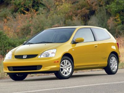 Front view of a compact hatchback with sleek headlights and aerodynamic design.