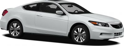 White two-door coupe with alloy wheels and tinted windows.
