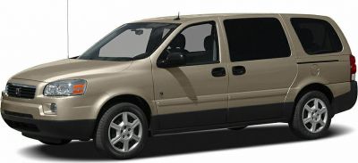 Minivan front side with sliding doors and tinted windows