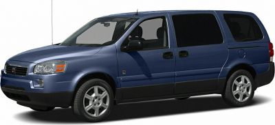 Side view of a minivan with sliding doors and alloy wheels