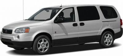 White minivan with sliding rear doors and silver multi-spoke alloy wheels