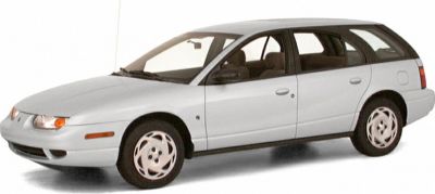 White 1990s wagon with rounded front and five-spoke wheels.