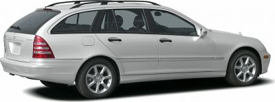 Side profile of a silver station wagon with alloy wheels and roof rails