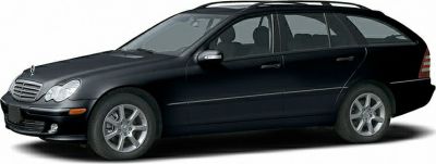 Black estate car with alloy wheels and roof rails, side view.