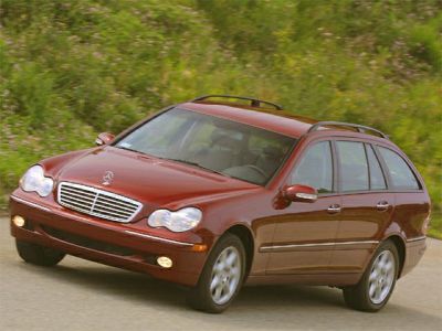 Front three-quarter view of a T-model station wagon with roof rails and distinctive headlights