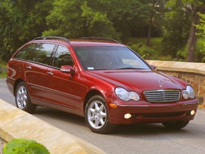 Red station wagon with distinctive front grille and alloy wheels.