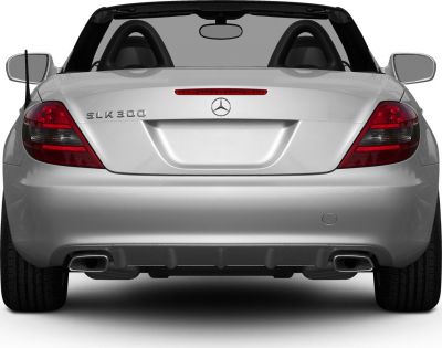 Rear view of silver convertible with dual exhaust and red tail lights