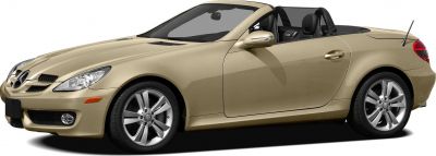 Beige sporty convertible roadster side view with alloy wheels