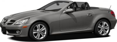 Gray convertible roadster with alloy wheels and soft top retracted