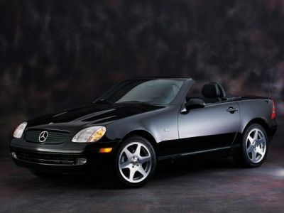 Sporty two-seater convertible with sleek alloy wheels and compact design