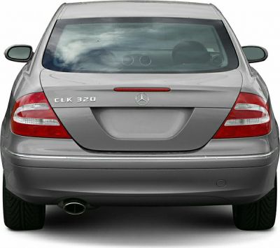 Rear view with tail lights, badge, trunk, and single exhaust.