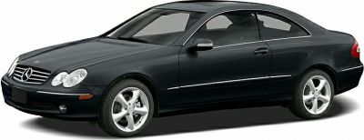 Glossy black coupe with dual headlights and alloy wheels