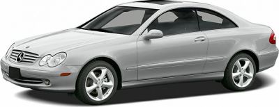 Silver two-door luxury coupe with sleek aerodynamic design and alloy wheels
