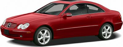 Sleek red coupe with refined headlights and sporty alloy wheels