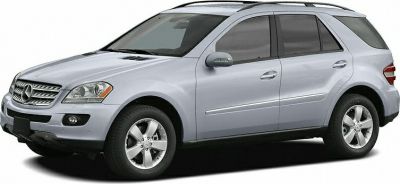 Silver SUV side and front angle with alloy wheels and roof rails