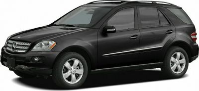 Black mid-size SUV with alloy wheels and tinted windows side profile