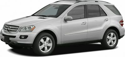 Silver mid-size luxury SUV with alloy wheels and roof rails
