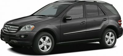 Side profile view of a mid-size luxury SUV with alloy wheels and tinted windows