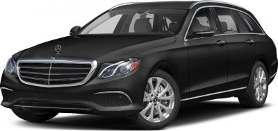 Front side view of station wagon with sleek headlights and grille