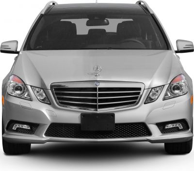 Front view with grille, emblem, and headlights of silver luxury wagon