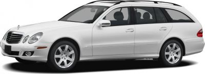 White estate station wagon with alloy wheels and long roof
