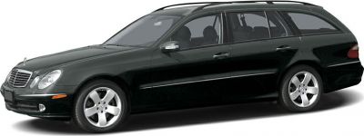 Side profile of a black luxury wagon with five-spoke alloy wheels