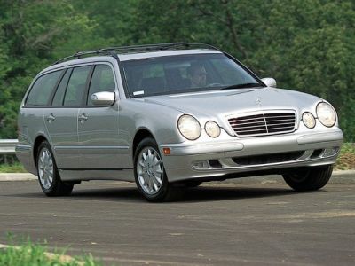 Silver station wagon with quad circular headlights and roof rails