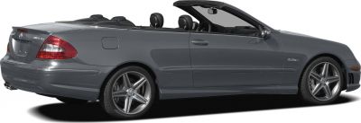 Grey convertible with AMG wheels and soft top down, side view