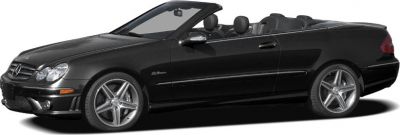 Side profile of a black convertible with alloy wheels and open roof.