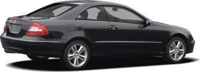 Rear side view of sleek two-door coupe with alloy wheels