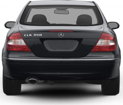 Rear view with tail lights and single exhaust of vehicle