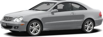 Side profile of a silver 2-door luxury coupe with alloy wheels