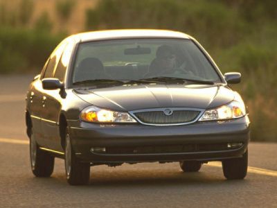 Front view with headlights and grille of a mid-size sedan