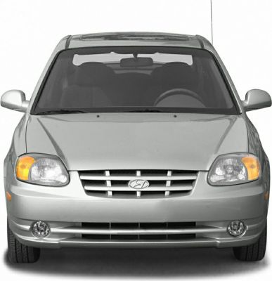 Classic front view with headlights, grille, and fog lights