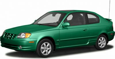 Green two-door hatchback front side view with clear headlights
