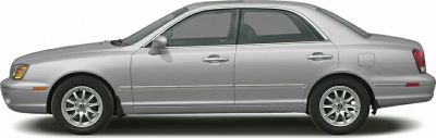 Silver four-door sedan with chrome trim and alloy wheels.