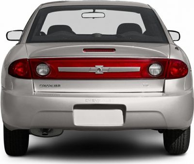 Rear view showing taillights and emblem on silver car