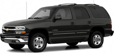 Black full-size SUV with chrome wheels and roof rails