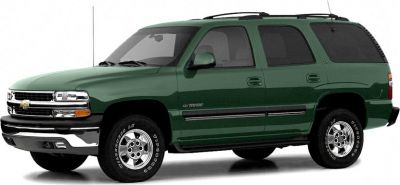 Side profile of full-size SUV with rugged tires and bold grille