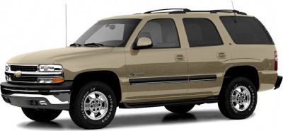 Beige full-size SUV with 4 doors and roof rails, side profile view
