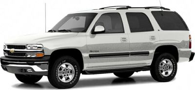 Side profile of a 2000 SUV with roof rack and alloy wheels