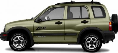Side profile of SUV with TR-2 badge and Goodyear Wrangler tires.
