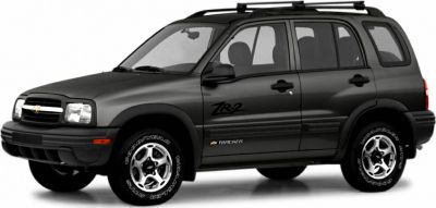 Side profile of a black off-road SUV with rugged tires and roof rack.