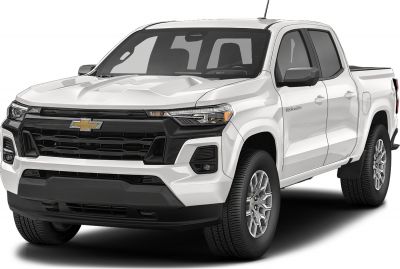 Front-side view of pickup truck with distinctive grille and alloy wheels