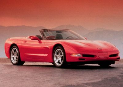 Red convertible sports car front side view with alloy wheels