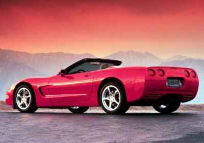 Red convertible sports car with distinct rear design and polished alloy wheels