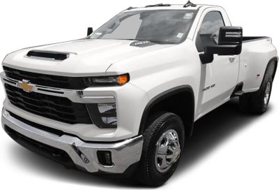 Front view of heavy-duty truck with hood scoop and dual rear wheels